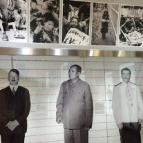 Lifesize portraits of past dictators according to height